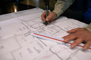 Lane French working with plans for a home remodel